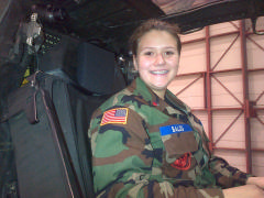 C/Amn Taylor Balog in the cockpit of an Apache attack helicopter at the Army Air National Guard hangar on Dec. 29, 2014.  