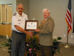 Capt. Gary Fischbach, Commander, MER-NC-170, presents Certificate of Appreciation to Don Hughes,BEMC CEO/General Manager. 
