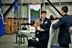 Maj Kathy Nicholas with award