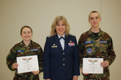 NCLA Cadet Commander Katlin C. Lanier (left) and NCLA Staff Sgt Seth D. Brannan (right) celebrate their Wright Brothers Awards with Lt Col Shelley Gonzales (center), the NCLA Cadet Squadron Commander, at the CAP Congressional Gold Medal ceremony in K