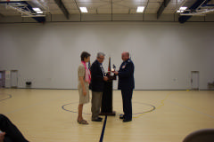 Col David Crawford presents CAP’s Congressional Gold Medal to Col Charles “Weldon” Fields, Sr.’s children: Charlanne Fields Tippett and Charles Weldon Fields II on Jan. 7, 2015.  