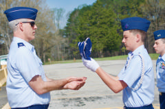 Cadet presents flag