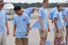 Male cadet gets shirt tails cut