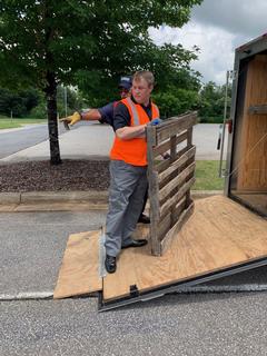 Men unloading trailer