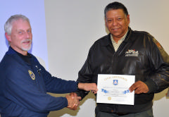 Maj Leighton presents certificate