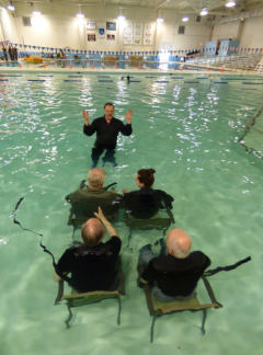 CAP members in chairs in pool
