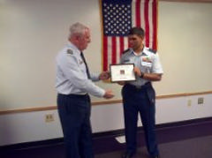 Capt Pete Wehr (left) presents C/1st Lt Eric Colquhoun with the 2014 Squadron Cadet of the Year Award on February 5, 2015.