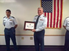 Capt Pete Wehr receives a Certificate of Appreciation from his grateful squadron at the February 5, 2015 Change-in-Command ceremony.