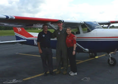 Cadet Riddell (center) is all smiles after earning wings.