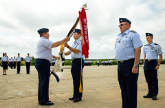 Col Bailey accepts flag at Change of Command