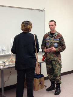 Cadet talks with parent about CAP
