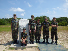 Cadets at the marker charting the path, distance and landing of the 4th flight.