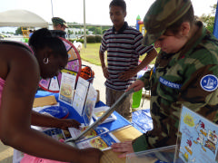 C/Amn Gabrielle Howell assisting staff from Zaxby’s as they set up their booth