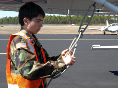 NC-170 Cadet A/1C Rory Gannon practices proper way to secure aircraft.