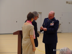 Col David Crawford presents CAP’s Congressional Gold Medal to Col Charles “Weldon” Fields, Sr.’s children: Charlanne Fields Tippett and Charles Weldon Fields II on Jan. 7, 2015.  