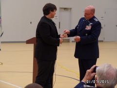 Col David Crawford presents CAP’s Congressional Gold Medal to Scottie Sigmon, on behalf of his grandfather, Lt Col Paul Sigmon on Jan. 7, 2015.  