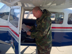 Lt Col Dion Viventi, Incident Commander, does a preflight check at RDU during the Jan. 17, 2015 SAREX.