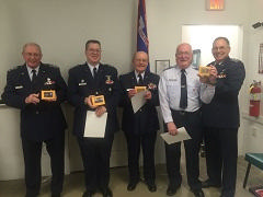 CLC Instructors (left to right) LtCol Bill Fleming, Maj. Joe Myers, and LtCols Bob Bauer, Joe Weinflash and Rich Augur pose for a picture with their cheese at awards night.